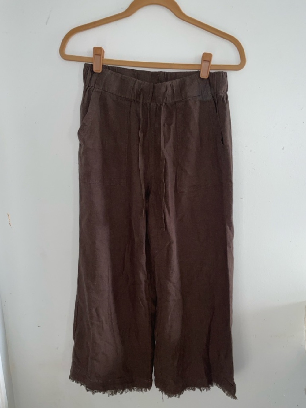 brown trousers from the brand Thread & Supply